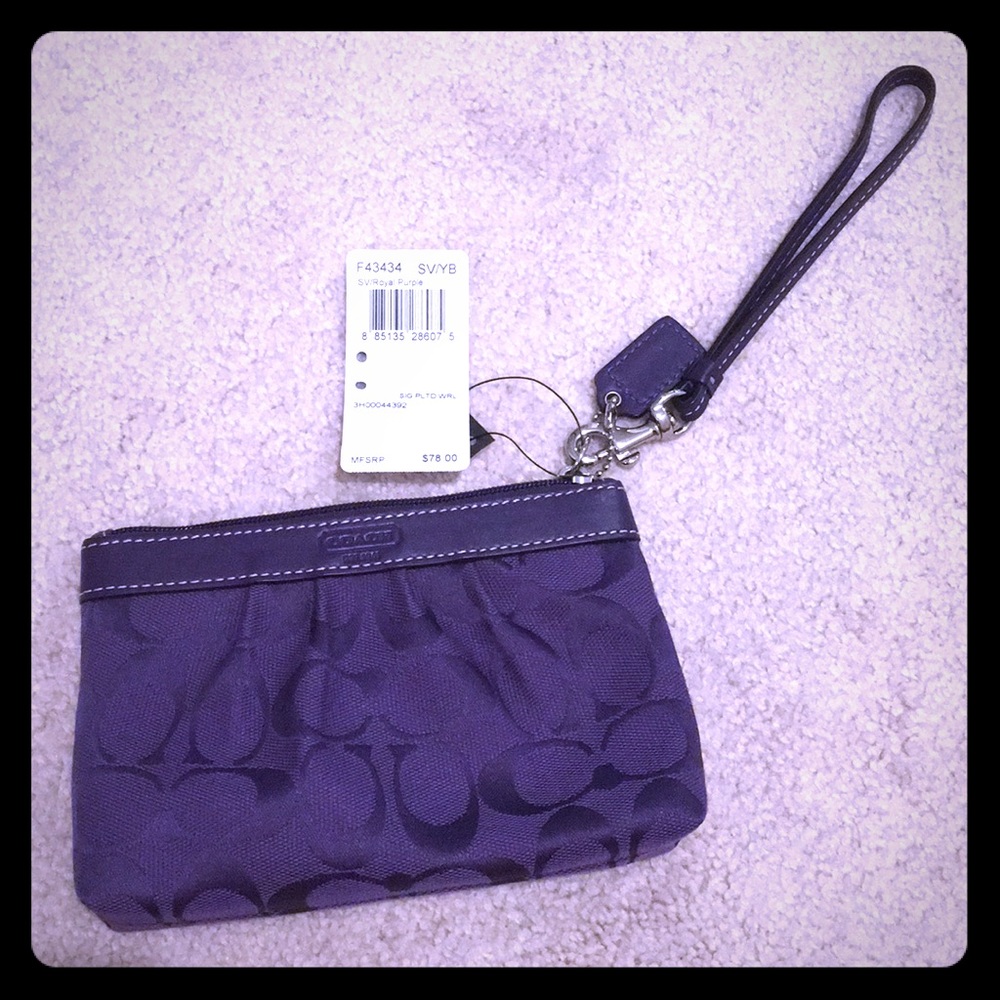 Dark purple Coach wristlet
